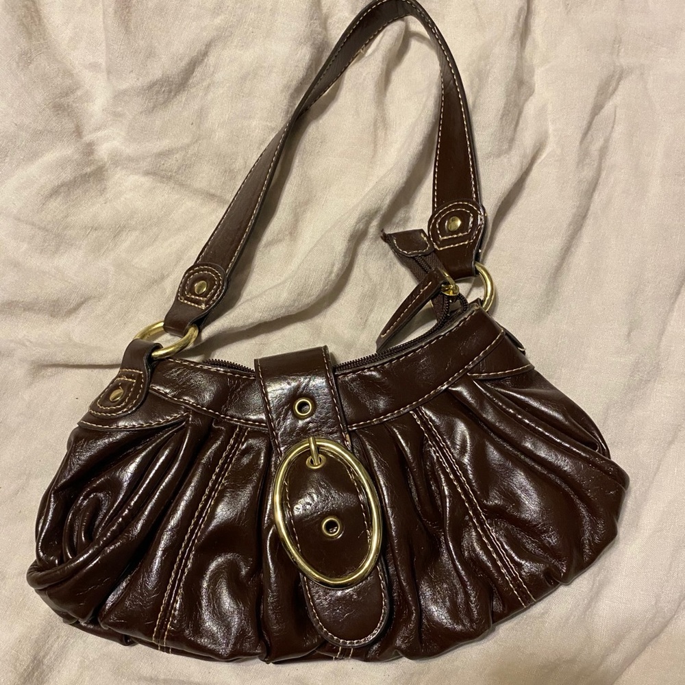 Small dark brown flap over purse